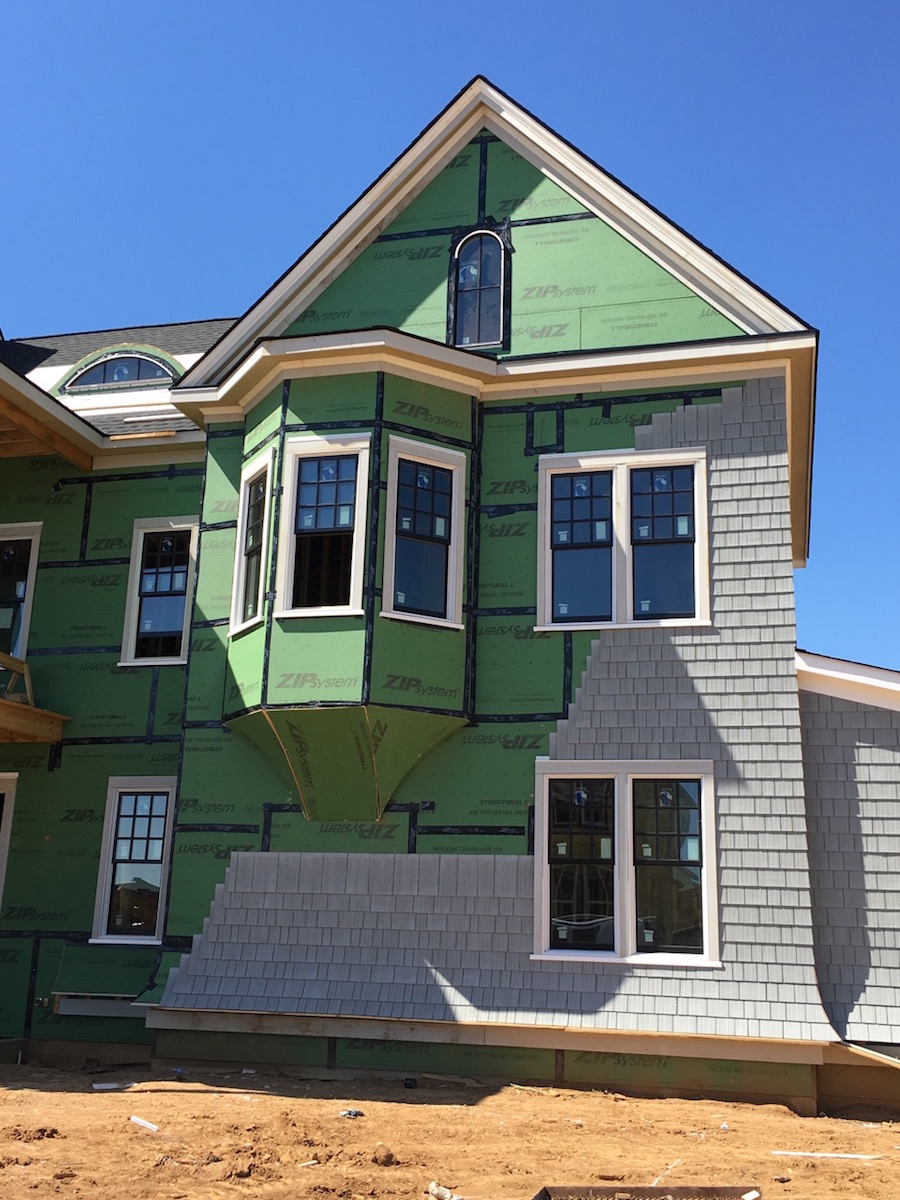 adding-cedar-shakes-to-luxury-home-exterior